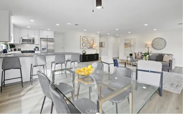 a large kitchen with a table and chairs