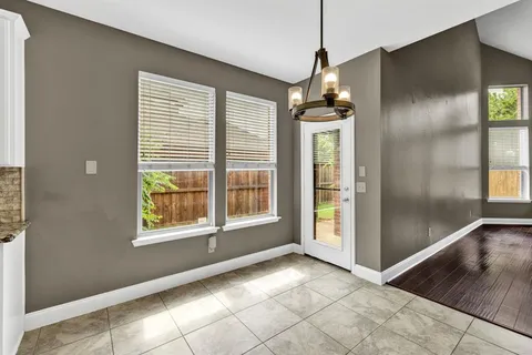 a view of an entryway with wooden floor and windows