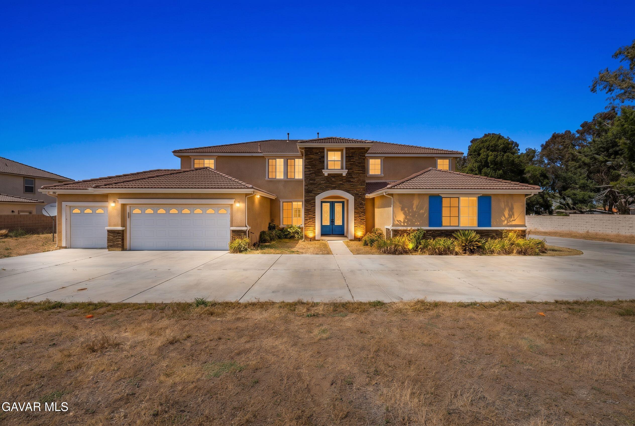 658 Lago Lindo Road Palmdale, CA 93550 - Photo 1 of 91 a front view of a house with a yard and garage