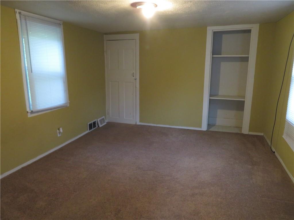 326 1st Street Apollo, PA 15613 - Photo 13 of 17 an empty room with windows and closet