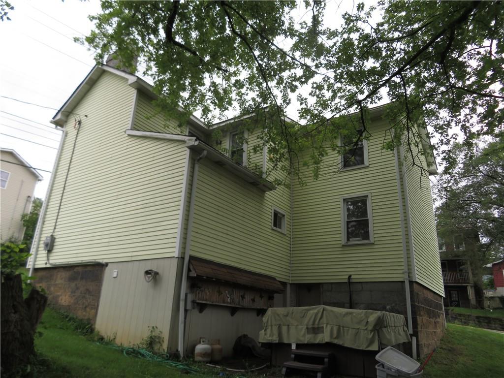 326 1st Street Apollo, PA 15613 - Photo 4 of 17 a front view of a house with garden