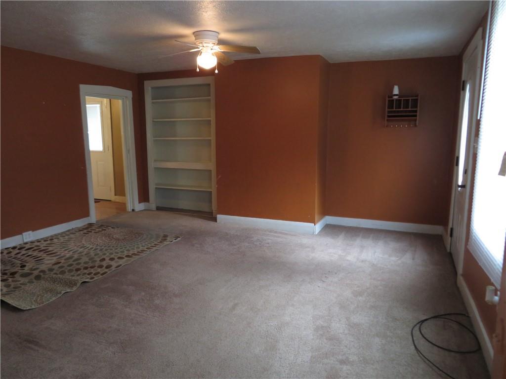326 1st Street Apollo, PA 15613 - Photo 8 of 17 an empty room with windows and cabinet