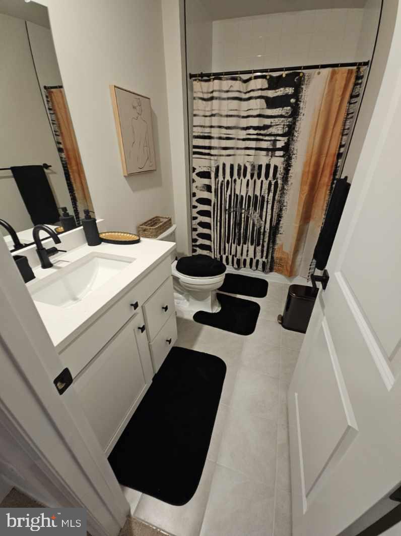 1425 Two Rivers Boulevard Odenton, MD 21113 - Photo 11 of 11 a bathroom with a sink and a mirror