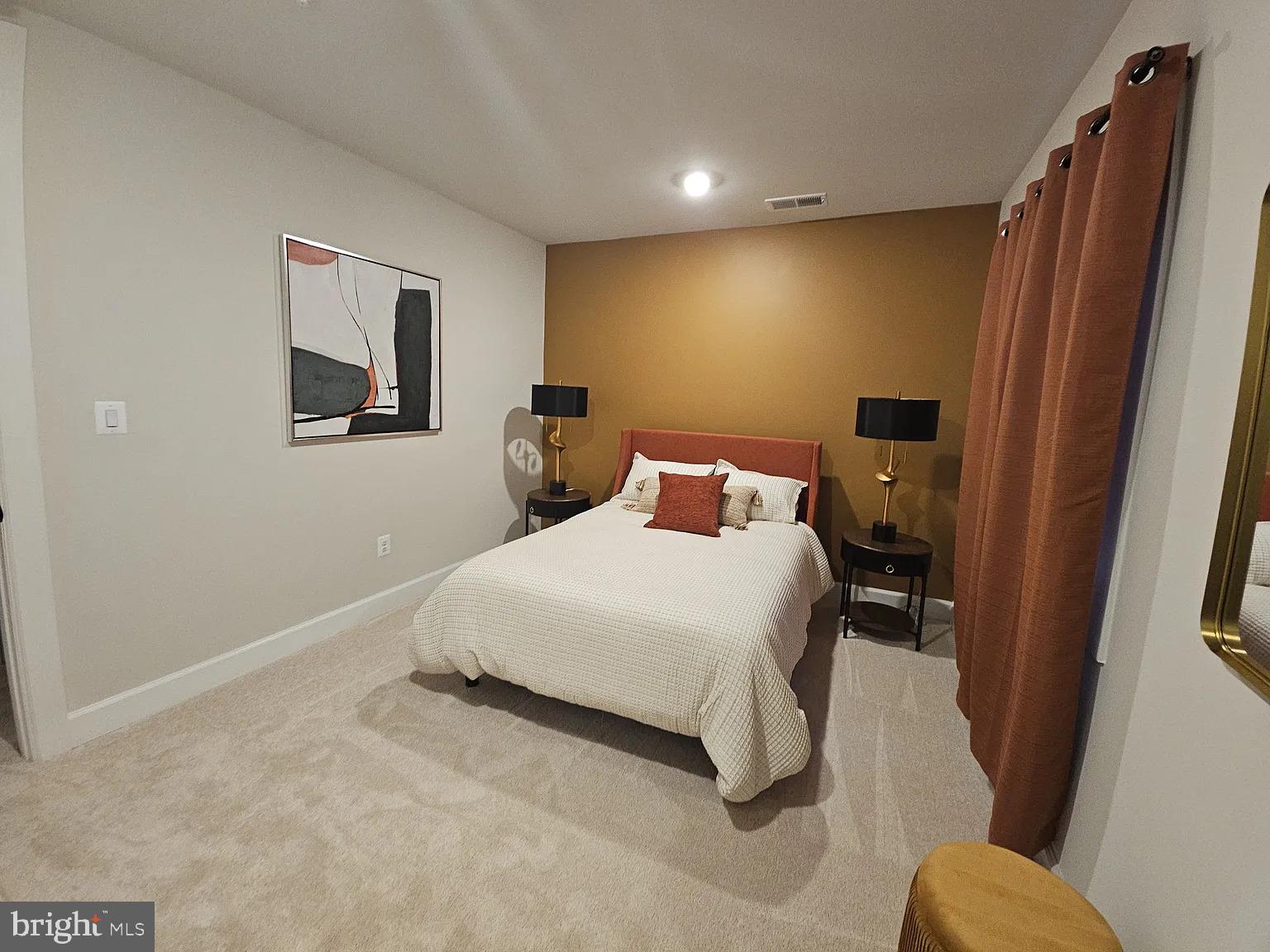 1425 Two Rivers Boulevard Odenton, MD 21113 - Photo 10 of 11 a bedroom with a bed and a large mirror