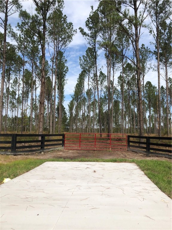 Lot 10 County Road Hilliard, FL 32046 - Photo 13 of 16 a view of park with wooden stairs and bench and trees around