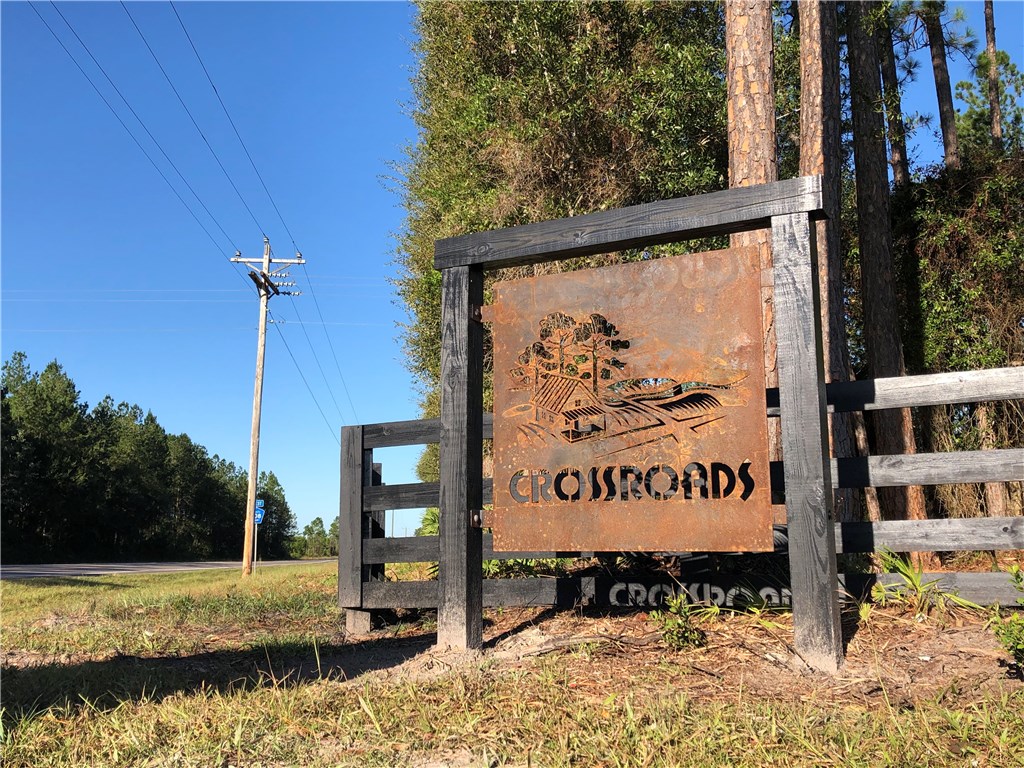 Lot 10 County Road Hilliard, FL 32046 - Photo 3 of 16 a sign on the side of the road