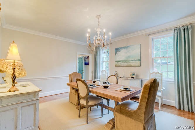 2300 Rochester Court Midlothian, VA 23113 - Photo 5 of 33 a dining room with furniture a chandelier and wooden floor
