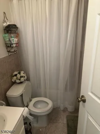 a bathroom with a toilet and a sink