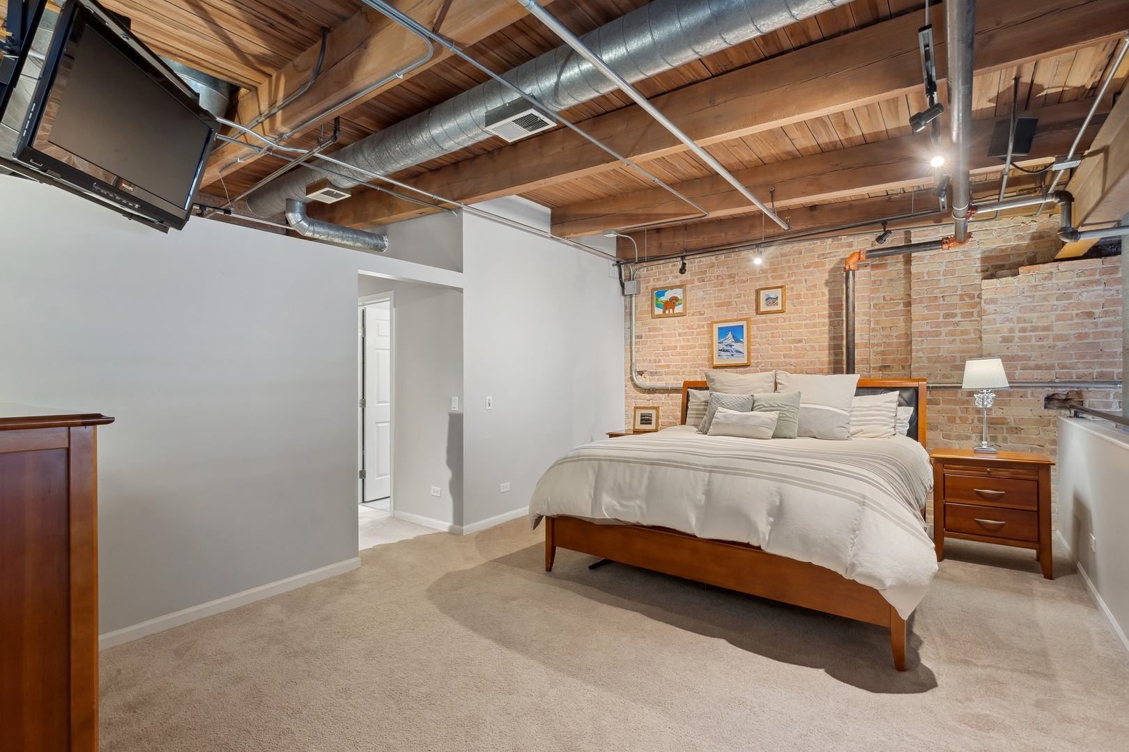 22 North Morgan Street, Unit 202 Chicago, IL 60607 - Photo 12 of 29 a spacious bedroom with a bed and a walk in closet