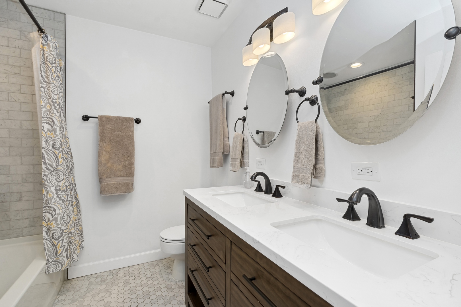 22 North Morgan Street, Unit 202 Chicago, IL 60607 - Photo 14 of 29 a bathroom with a double vanity sink a toilet and a mirror