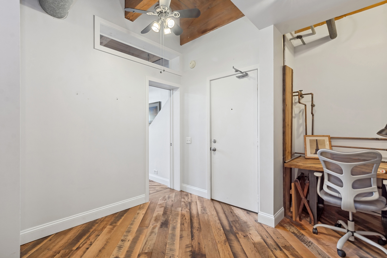 22 North Morgan Street, Unit 202 Chicago, IL 60607 - Photo 19 of 29 a view of a livingroom with wooden floor and furniture