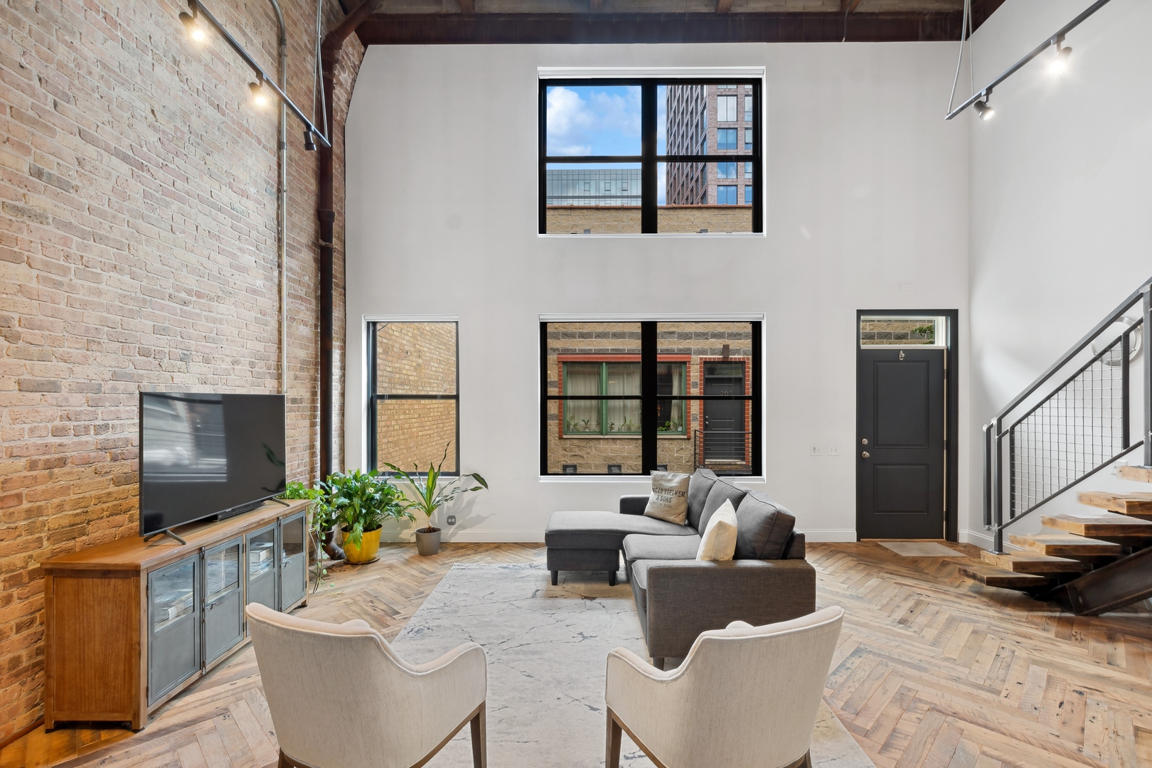22 North Morgan Street, Unit 202 Chicago, IL 60607 - Photo 2 of 29 a living room with furniture windows and a flat screen tv