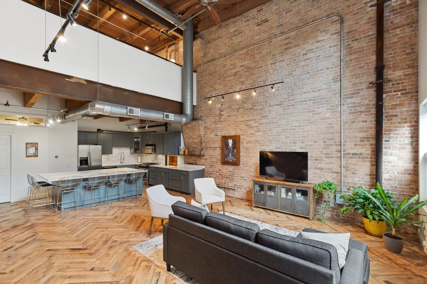 22 North Morgan Street, Unit 202 Chicago, IL 60607 - Photo 4 of 29 a living room with furniture a flat screen tv and a fireplace