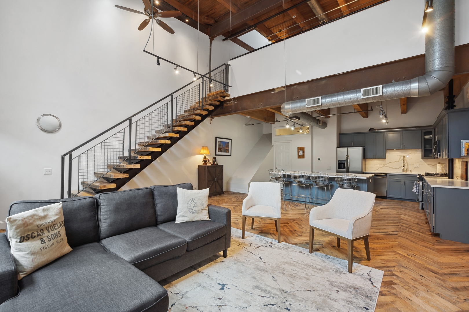 22 North Morgan Street, Unit 202 Chicago, IL 60607 - Photo 5 of 29 a living room with furniture and a wooden floor