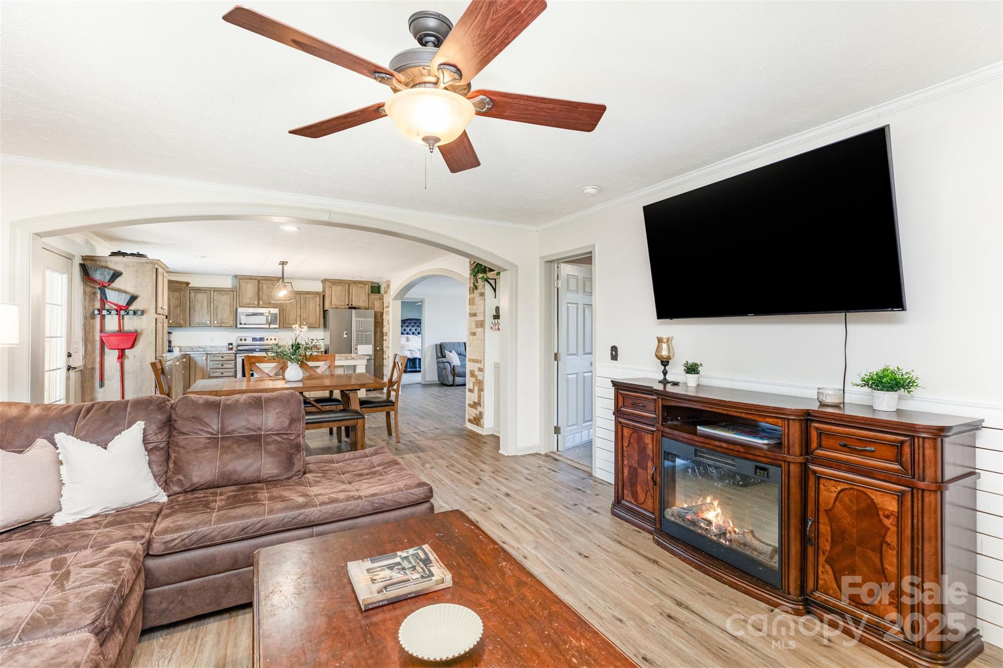 4110 Pebblebrook Circle Southwest Concord, NC 28027 - Photo 11 of 39 a living room with furniture and a flat screen tv