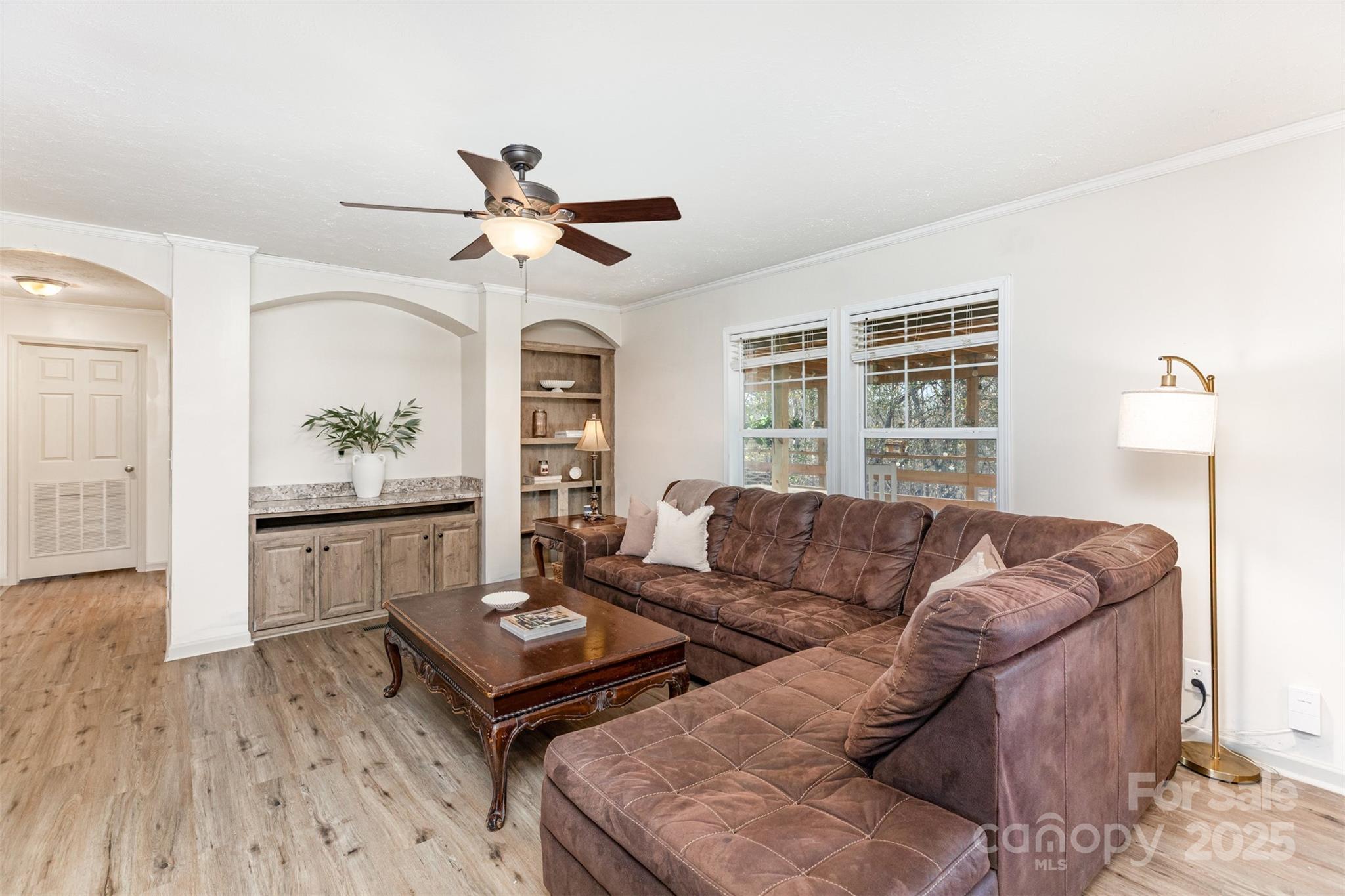 4110 Pebblebrook Circle Southwest Concord, NC 28027 - Photo 12 of 39 a living room with furniture and a window