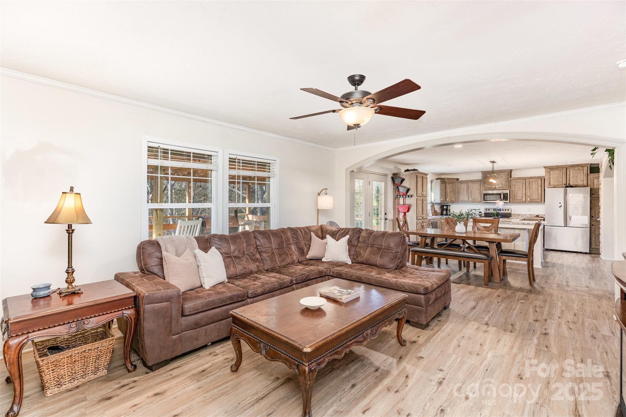 4110 Pebblebrook Circle Southwest Concord, NC 28027 - Photo 13 of 39 a living room with furniture a rug and a flat screen tv