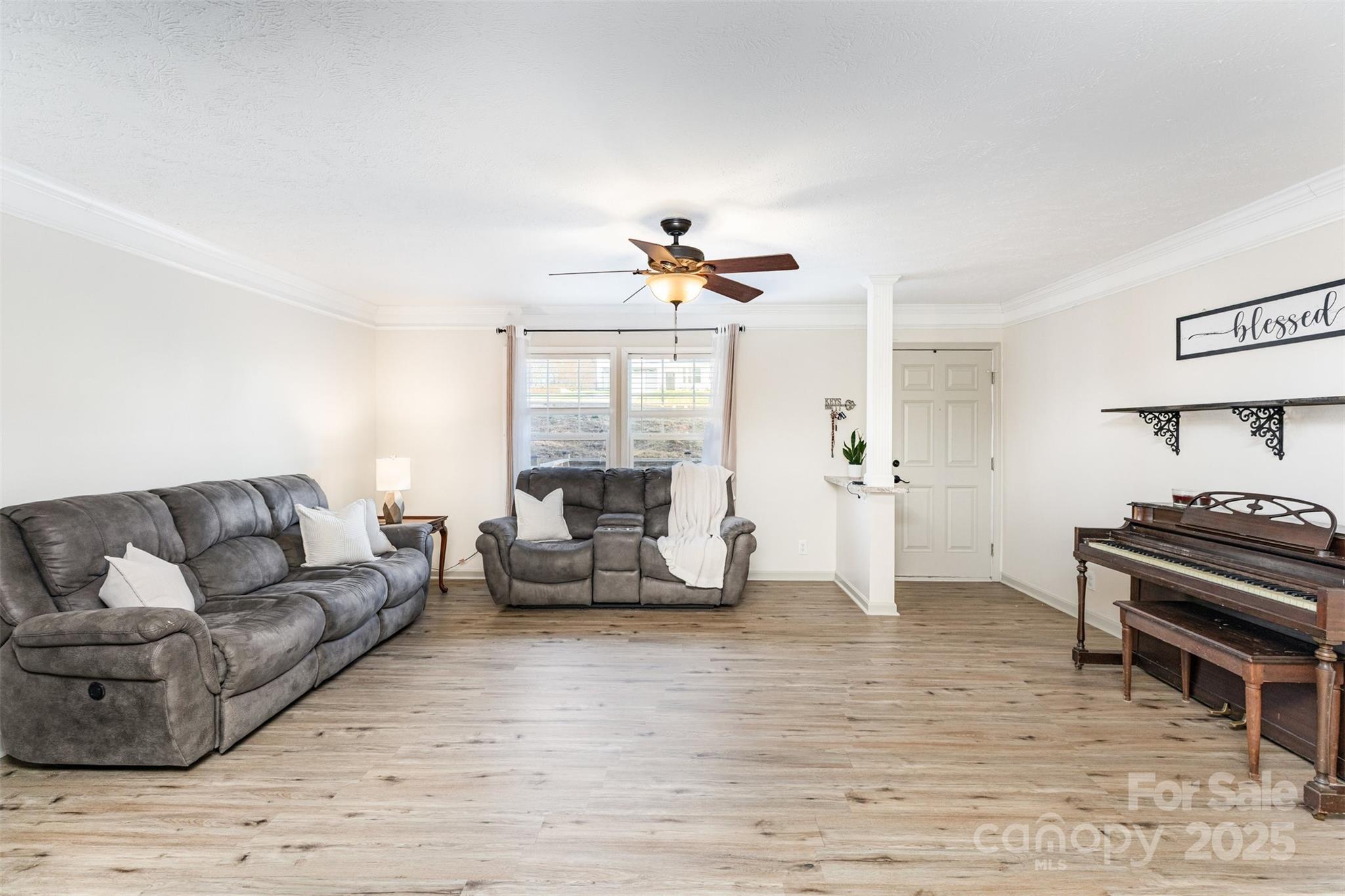 4110 Pebblebrook Circle Southwest Concord, NC 28027 - Photo 14 of 39 a living room with furniture and a fireplace