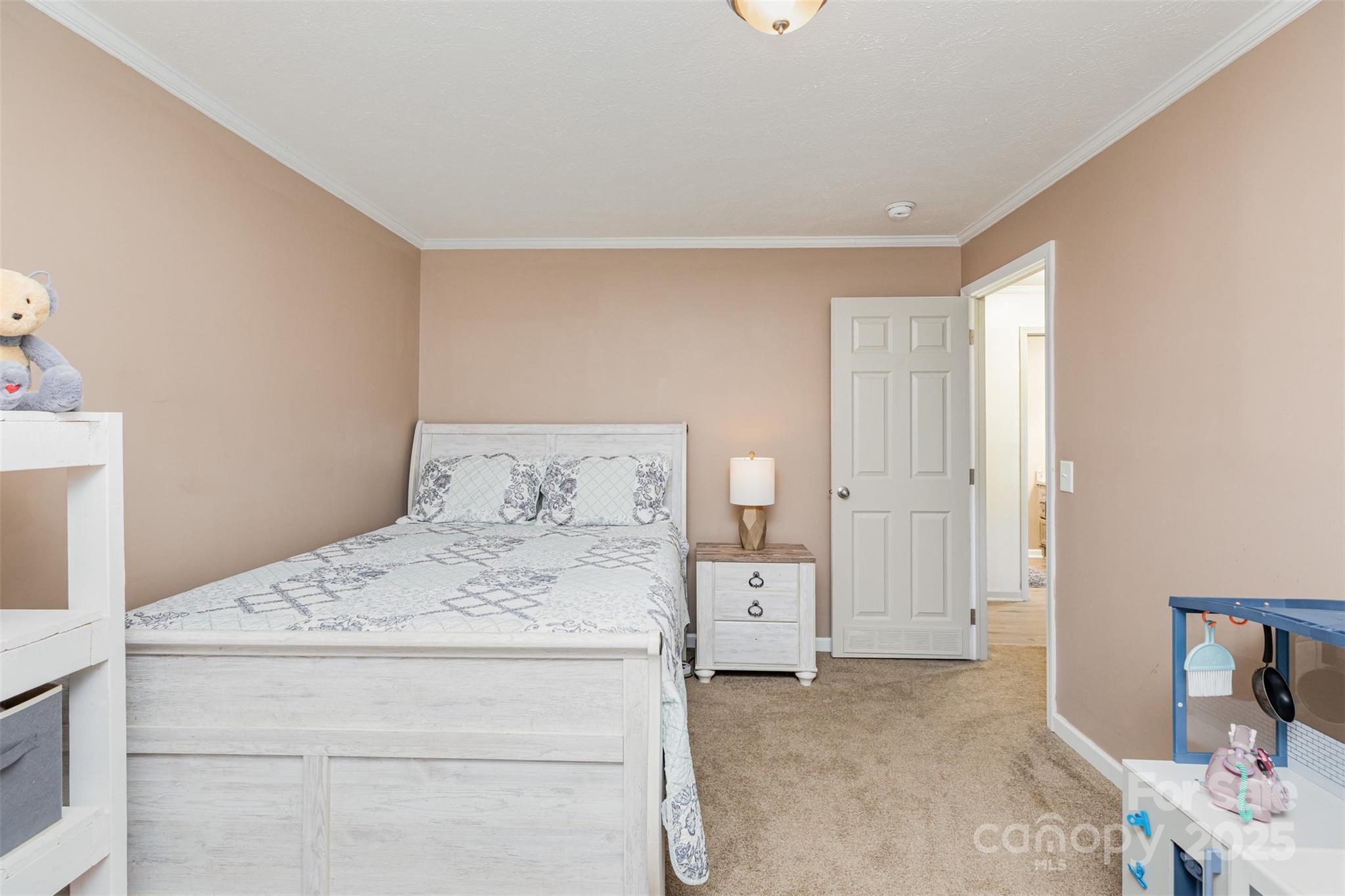 4110 Pebblebrook Circle Southwest Concord, NC 28027 - Photo 26 of 39 a bedroom with a bed and a cabinets