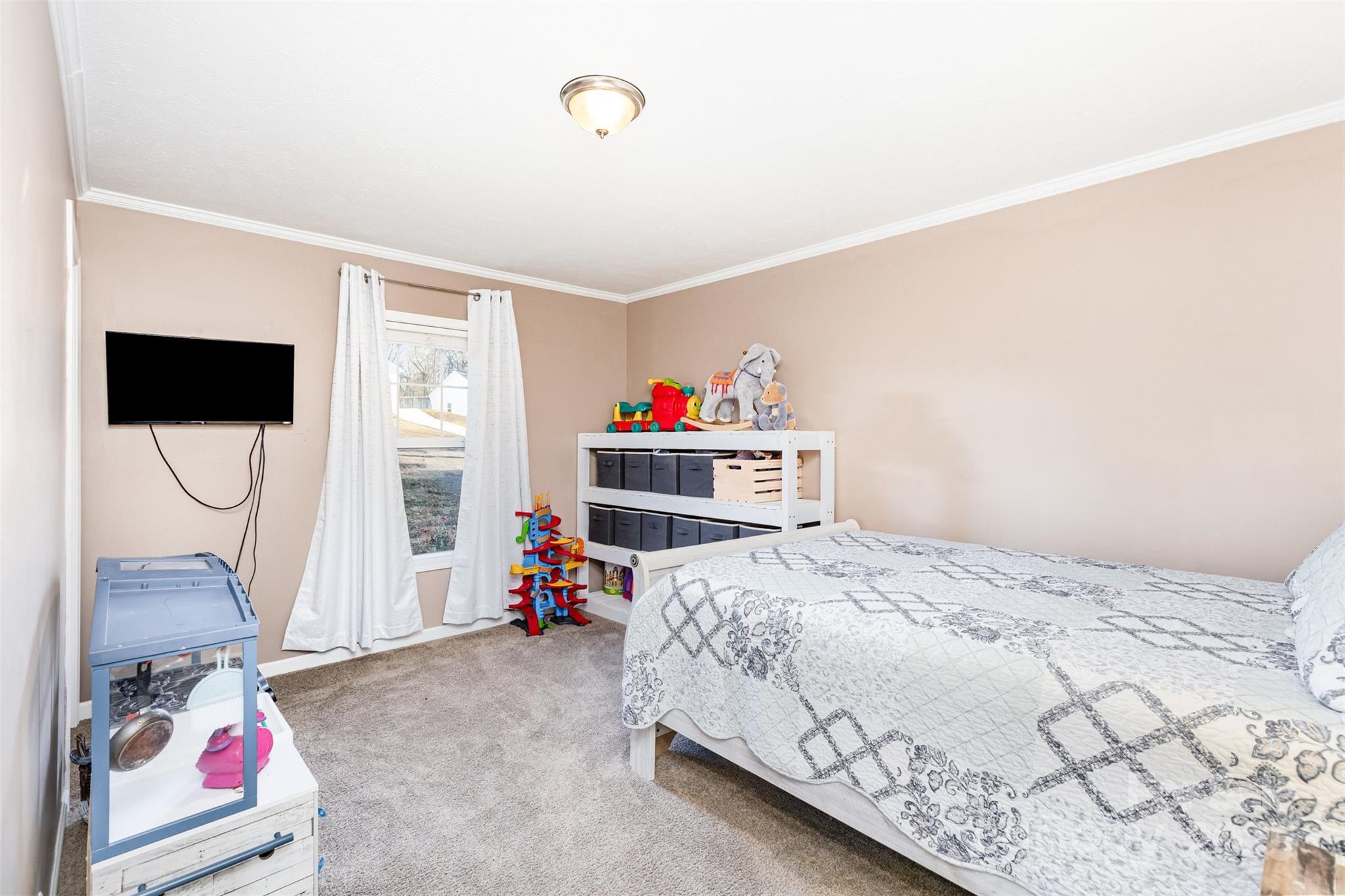 4110 Pebblebrook Circle Southwest Concord, NC 28027 - Photo 27 of 39 a bedroom with a bed and a window