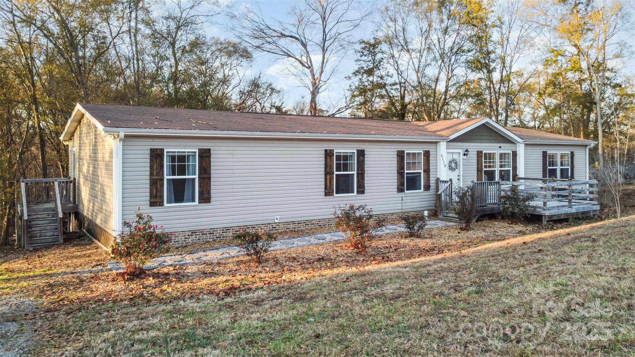 4110 Pebblebrook Circle Southwest Concord, NC 28027 - Photo 37 of 39 a front view of a house with yard