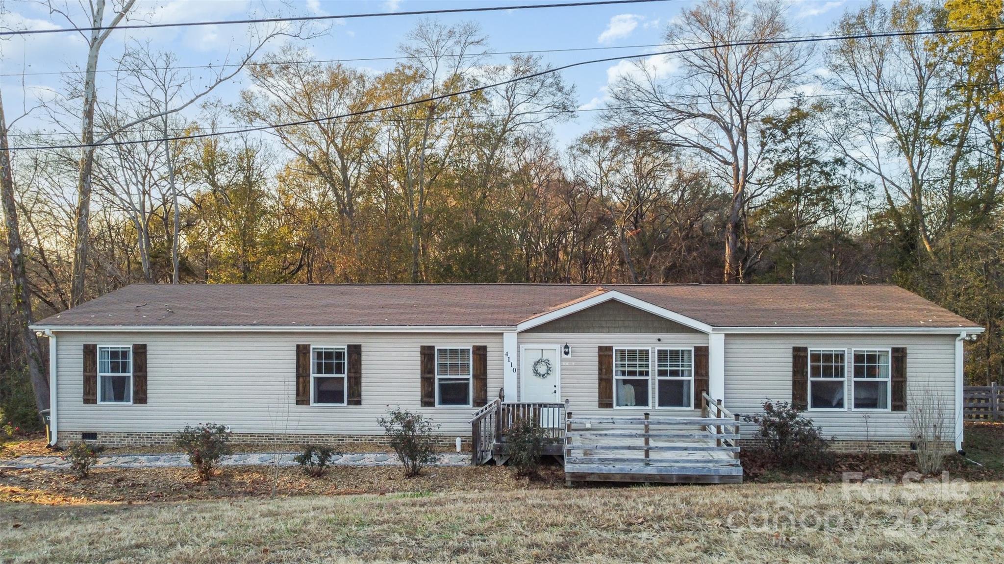 4110 Pebblebrook Circle Southwest Concord, NC 28027 - Photo 4 of 39 a front view of a house with garden
