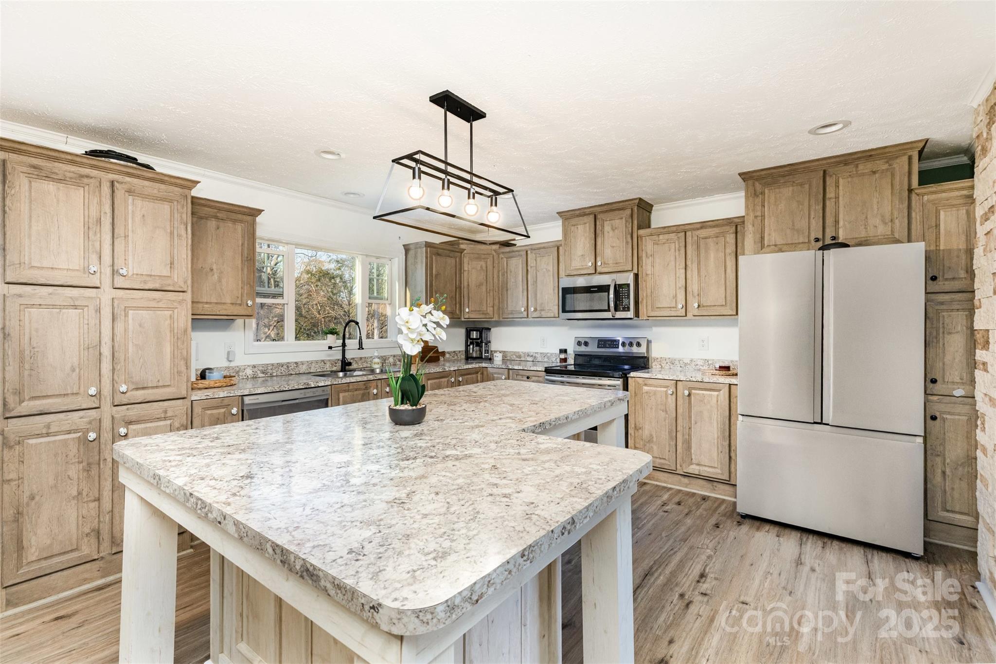 4110 Pebblebrook Circle Southwest Concord, NC 28027 - Photo 7 of 39 a kitchen with stainless steel appliances granite countertop a refrigerator a stove top oven a sink and dishwasher