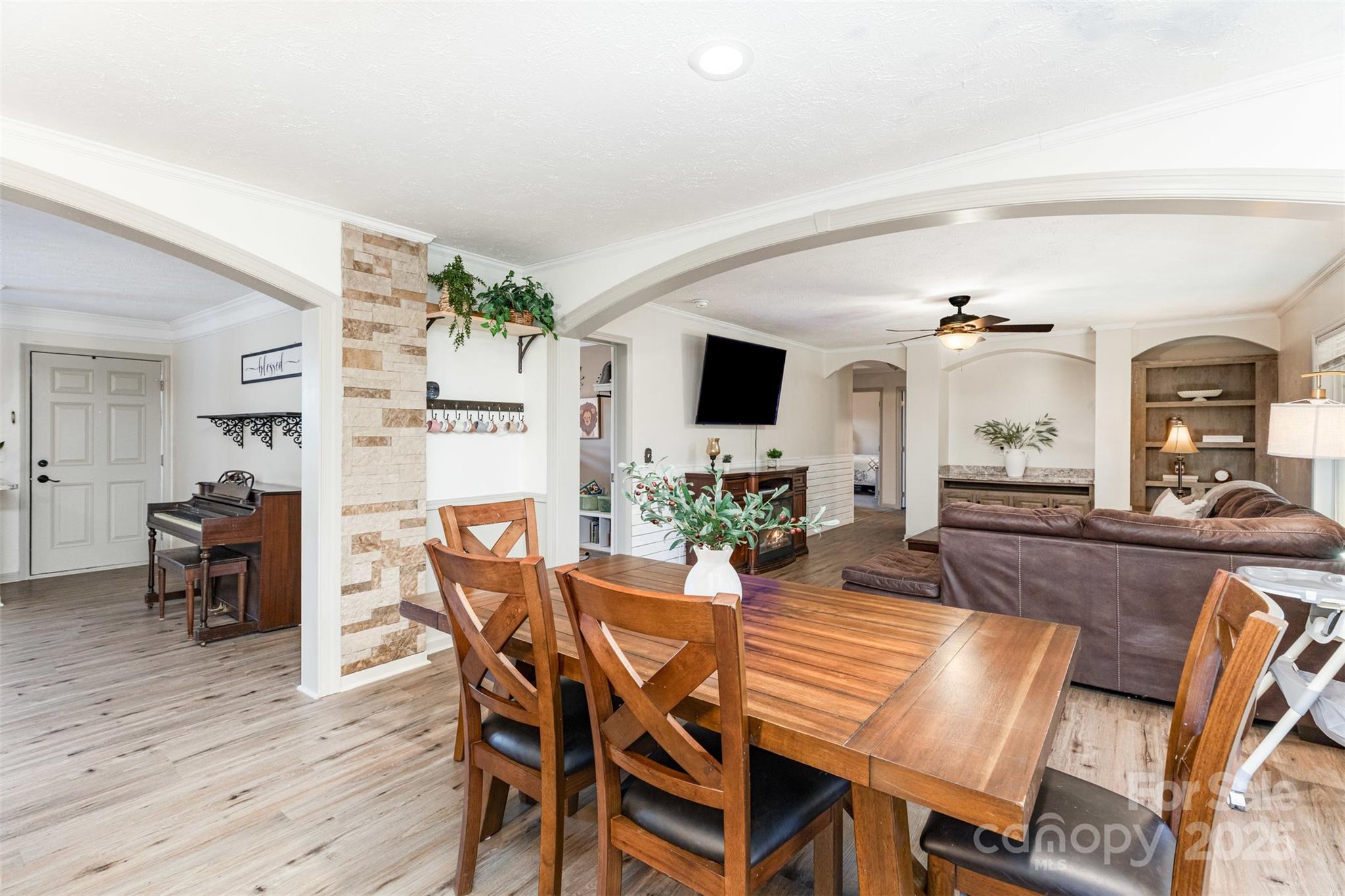 4110 Pebblebrook Circle Southwest Concord, NC 28027 - Photo 9 of 39 a view of a dining room with furniture and wooden floor