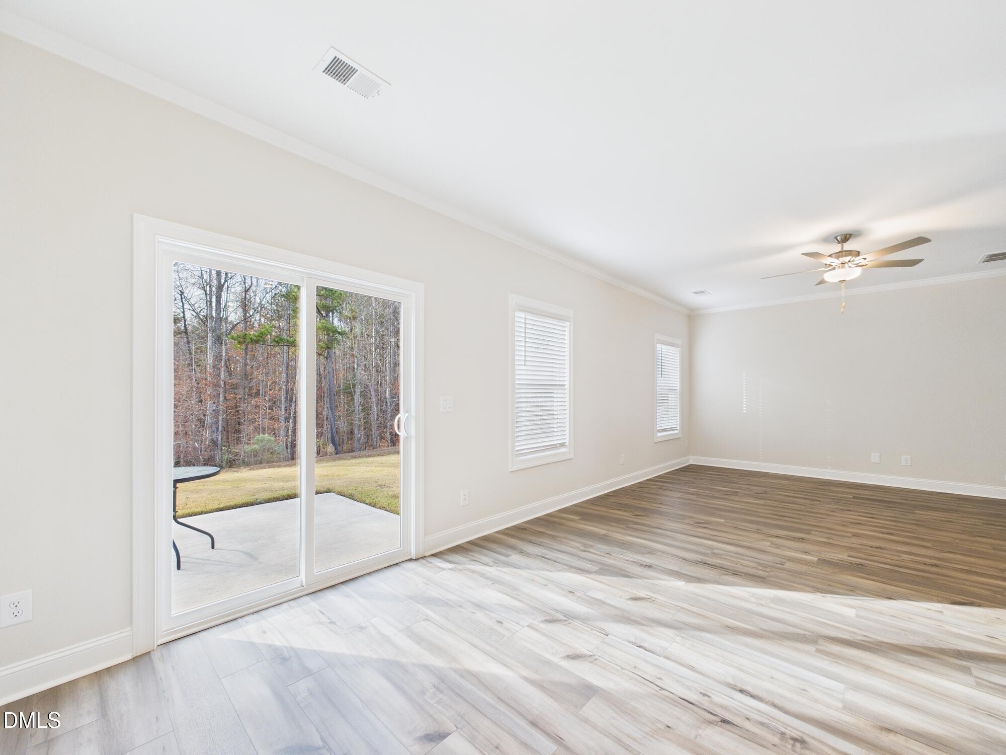 110 Symmetry Loop Youngsville, NC 27596 - Photo 23 of 72 a view of an empty room with glass door