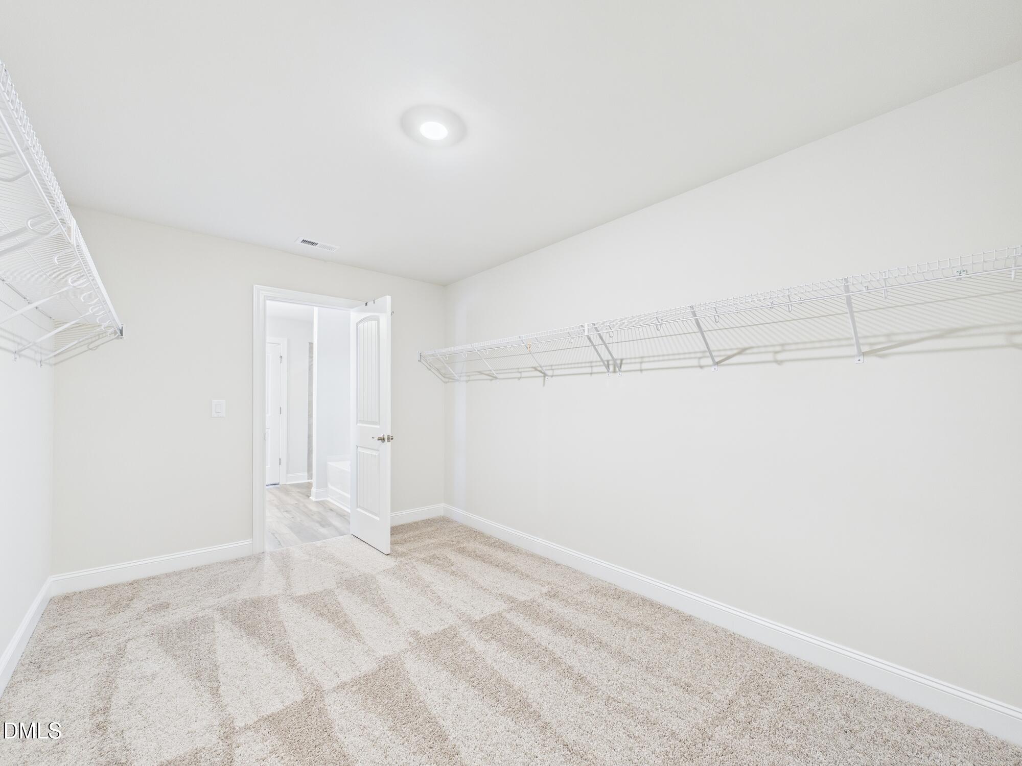 110 Symmetry Loop Youngsville, NC 27596 - Photo 44 of 72 a view of a room with an empty space