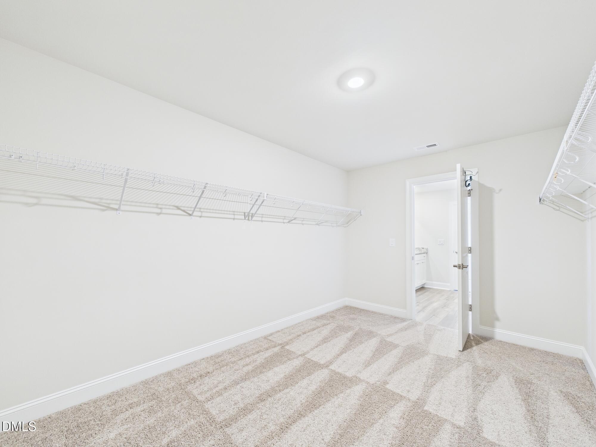 110 Symmetry Loop Youngsville, NC 27596 - Photo 45 of 72 a view of a room with an empty space