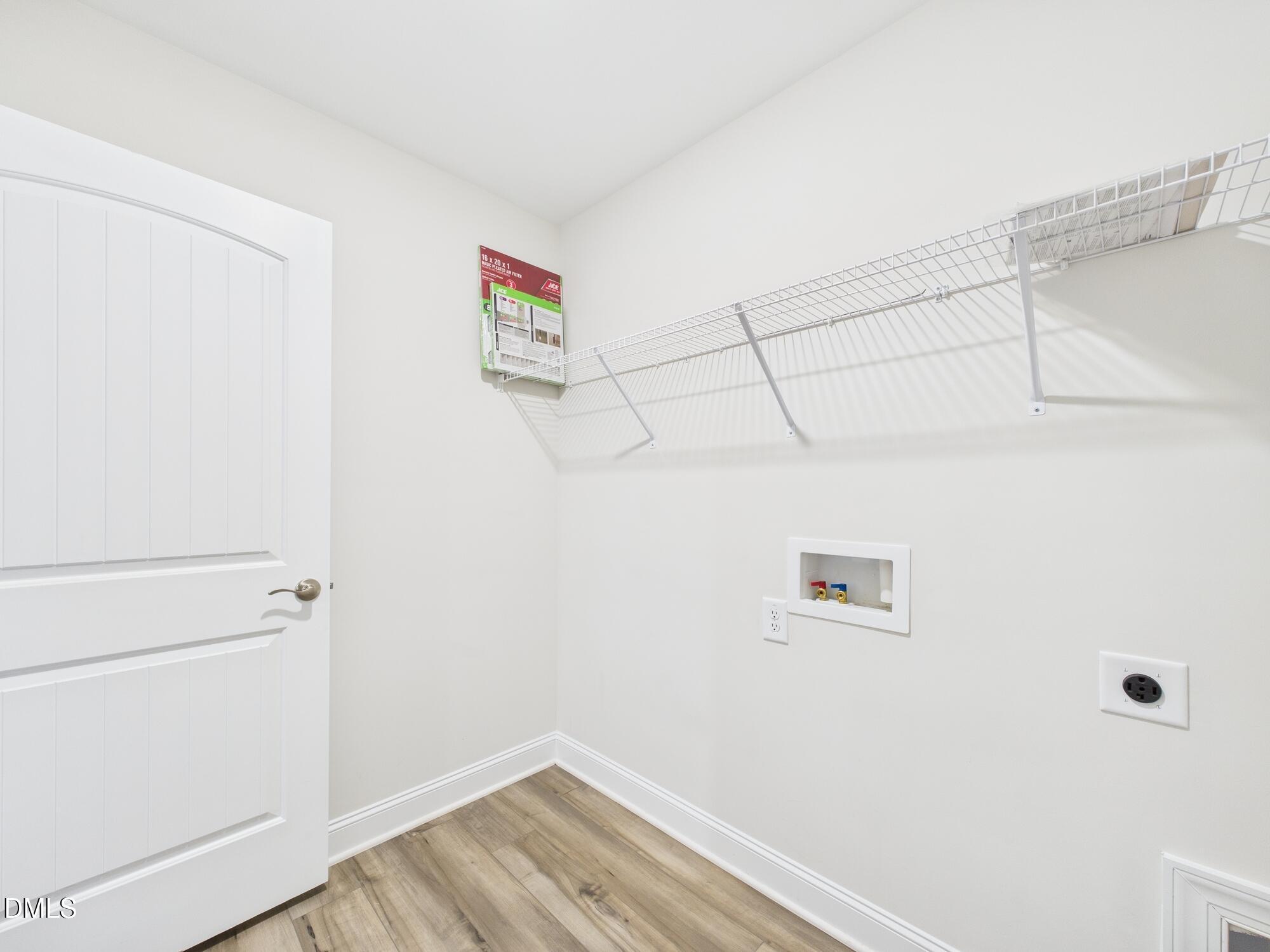 110 Symmetry Loop Youngsville, NC 27596 - Photo 48 of 72 a view of a room with racks on the wall