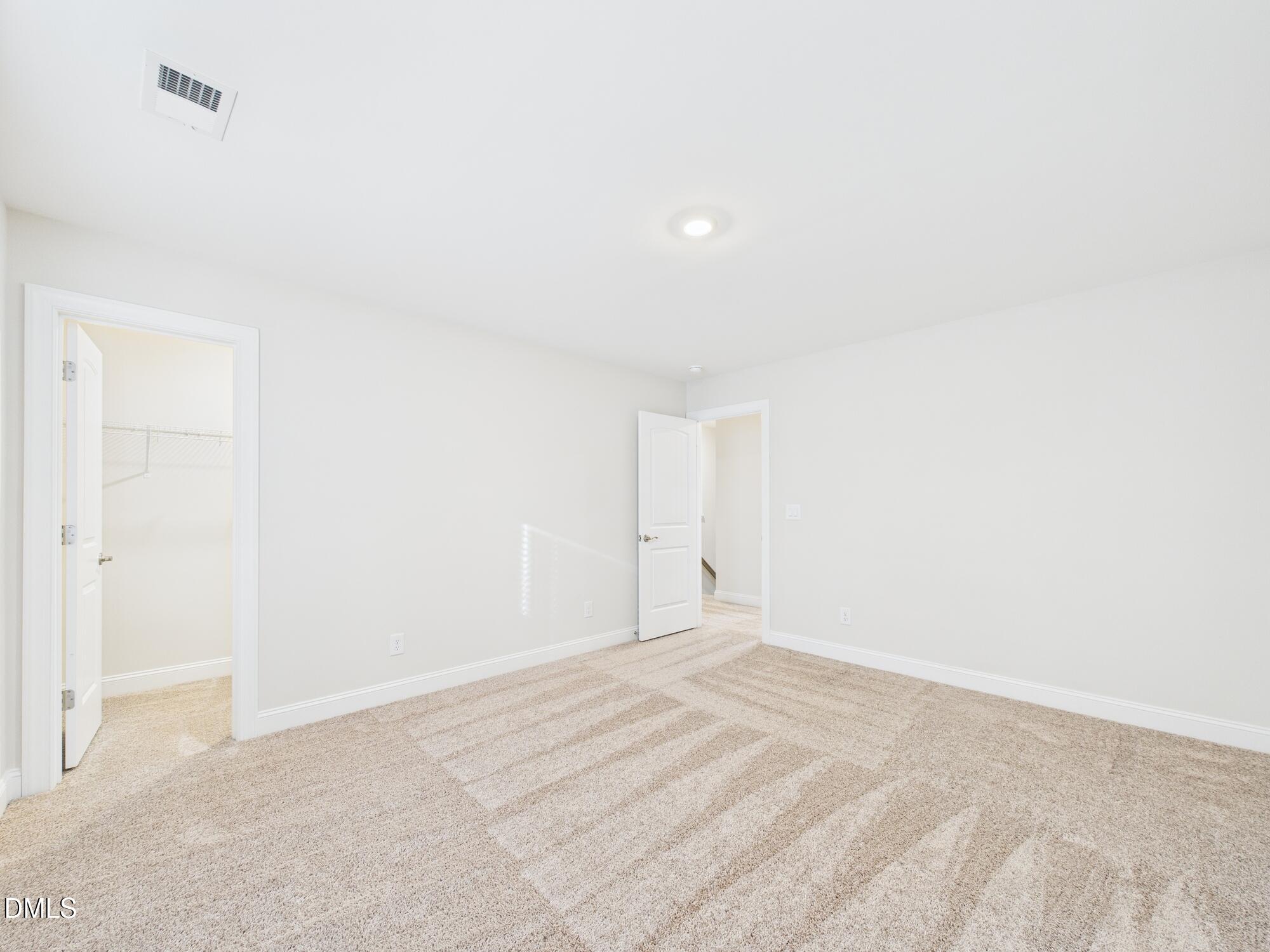110 Symmetry Loop Youngsville, NC 27596 - Photo 56 of 72 a view of an empty room