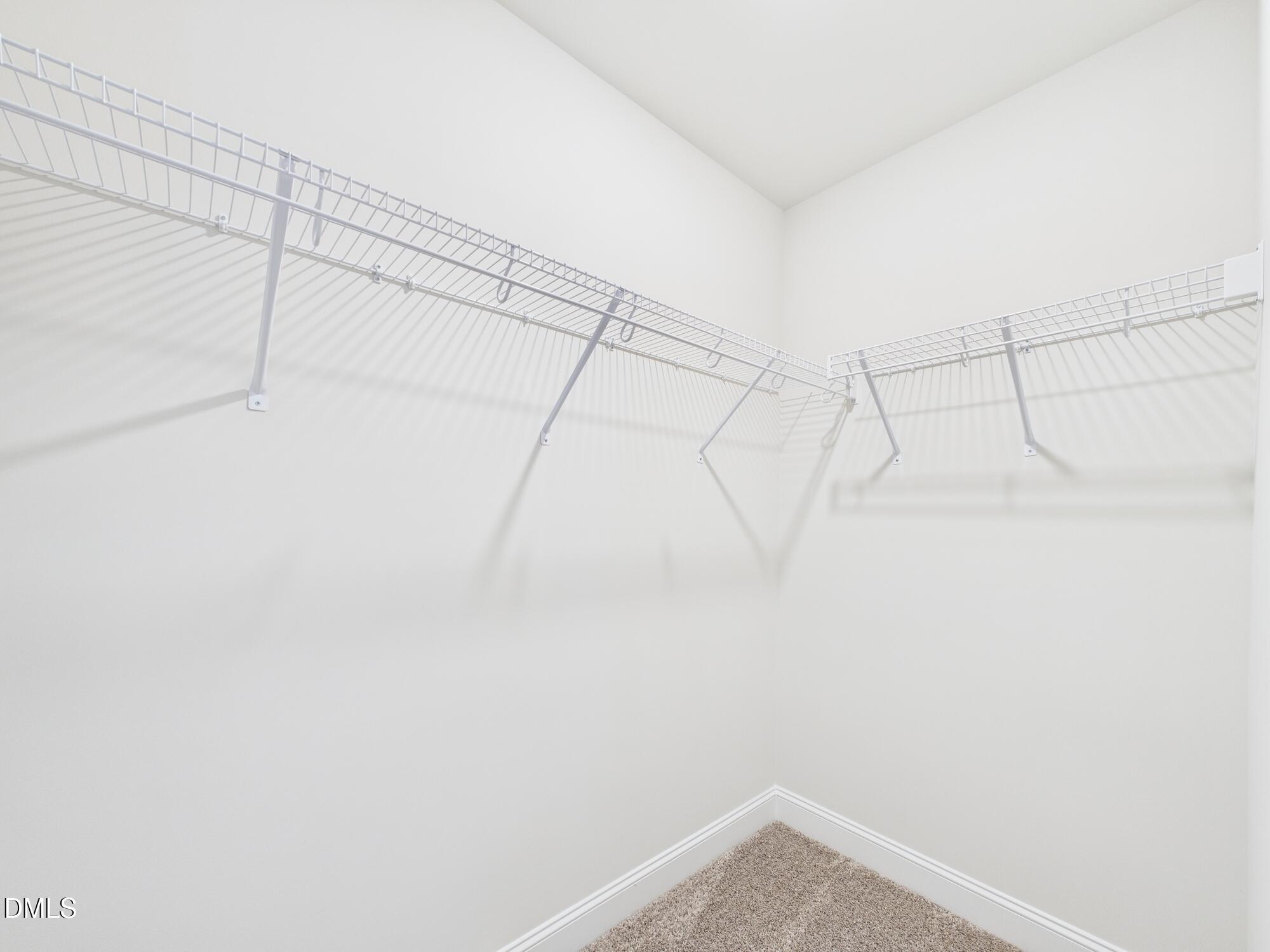 110 Symmetry Loop Youngsville, NC 27596 - Photo 58 of 72 a view of a room with racks on the wall