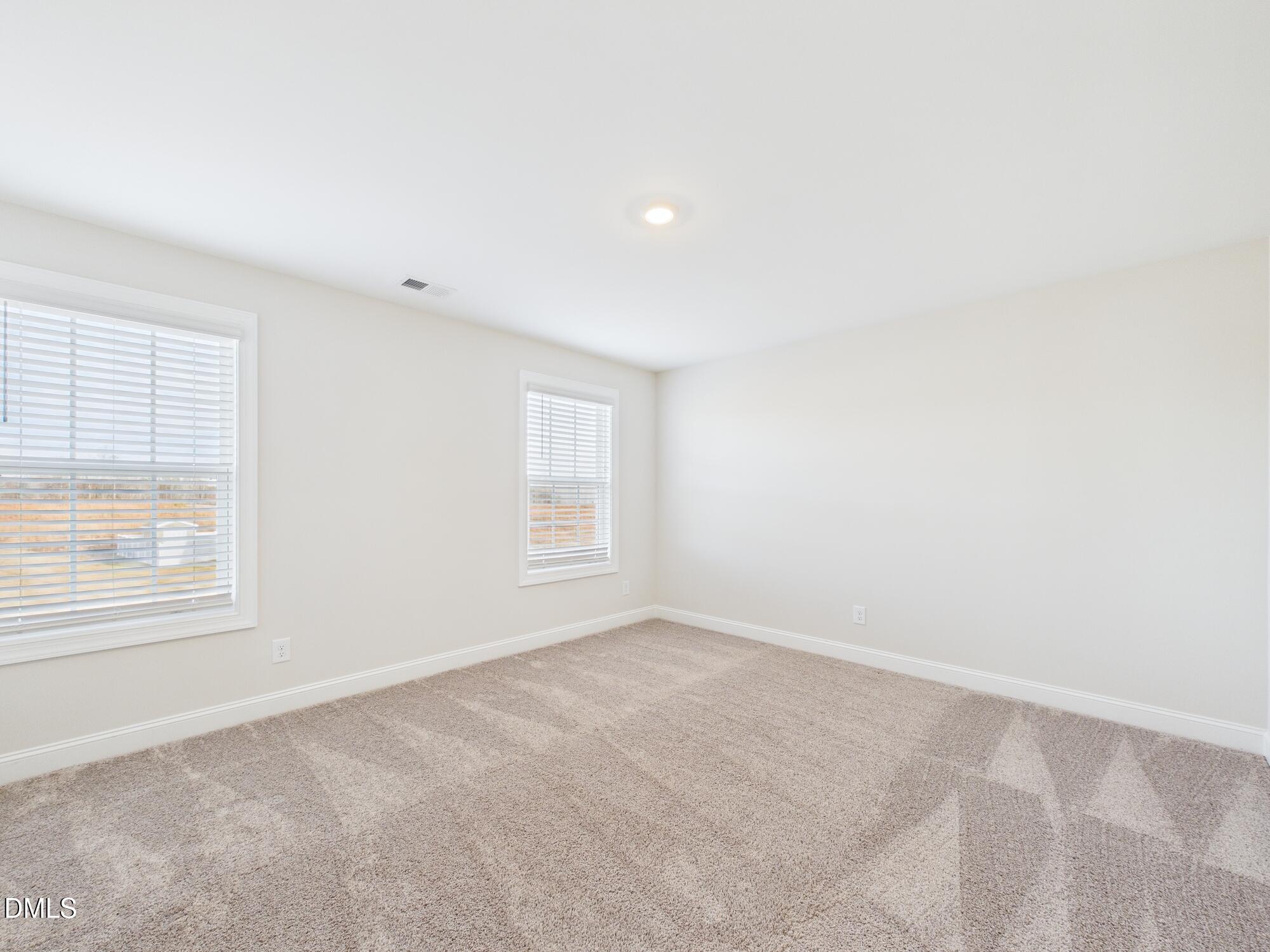110 Symmetry Loop Youngsville, NC 27596 - Photo 61 of 72 an empty room with a window