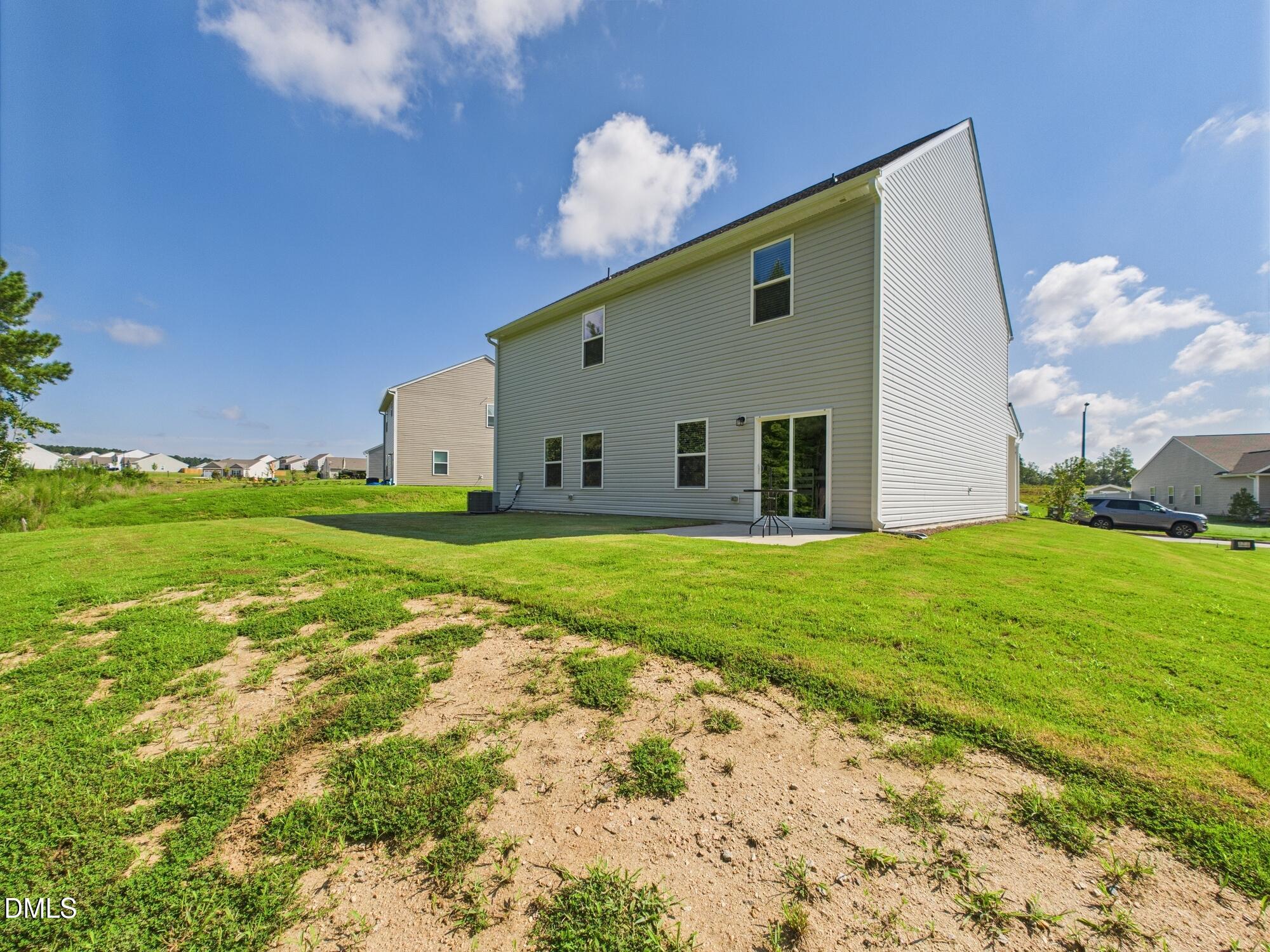 110 Symmetry Loop Youngsville, NC 27596 - Photo 69 of 72 a view of a house with backyard