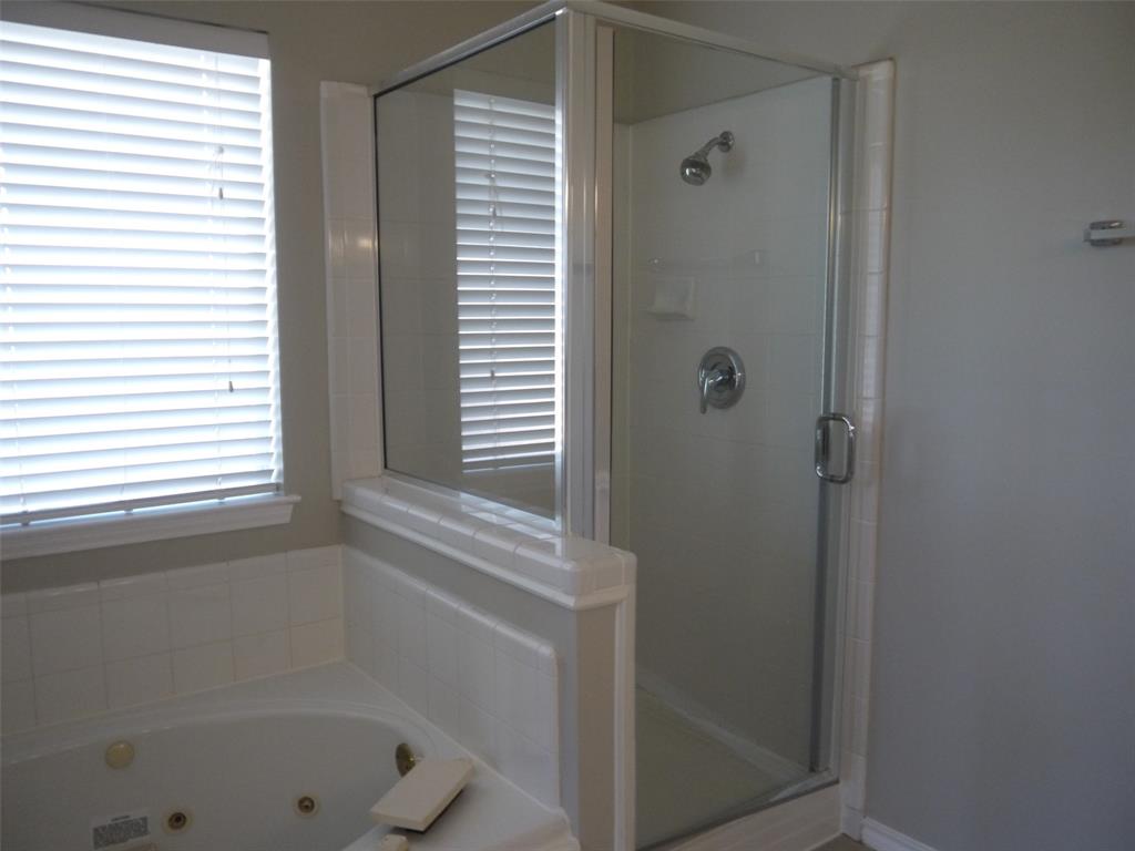 10931 Castle Drive Frisco, TX 75035 - Photo 11 of 14 a bathroom with a shower