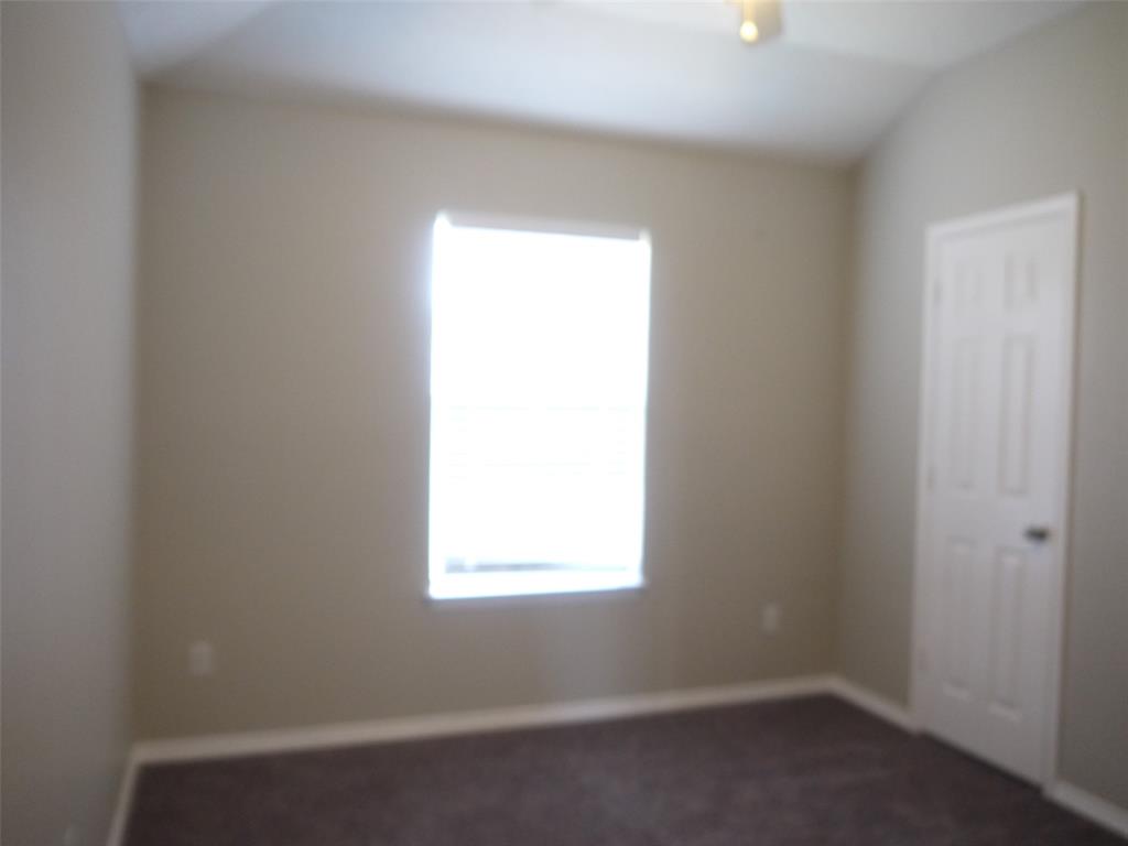 10931 Castle Drive Frisco, TX 75035 - Photo 13 of 14 an empty room with a window