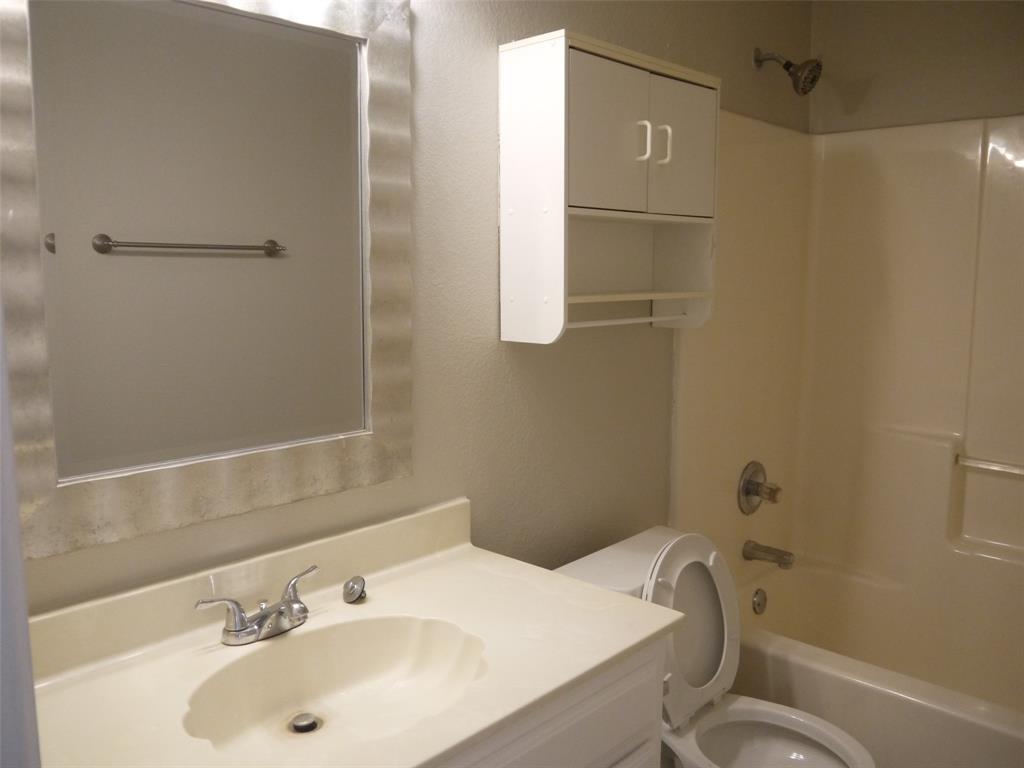 10931 Castle Drive Frisco, TX 75035 - Photo 14 of 14 a bathroom with a sink toilet and shower