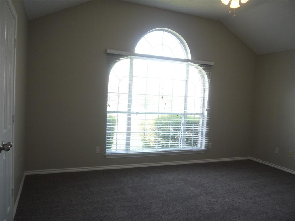 10931 Castle Drive Frisco, TX 75035 - Photo 8 of 14 an empty room with a window