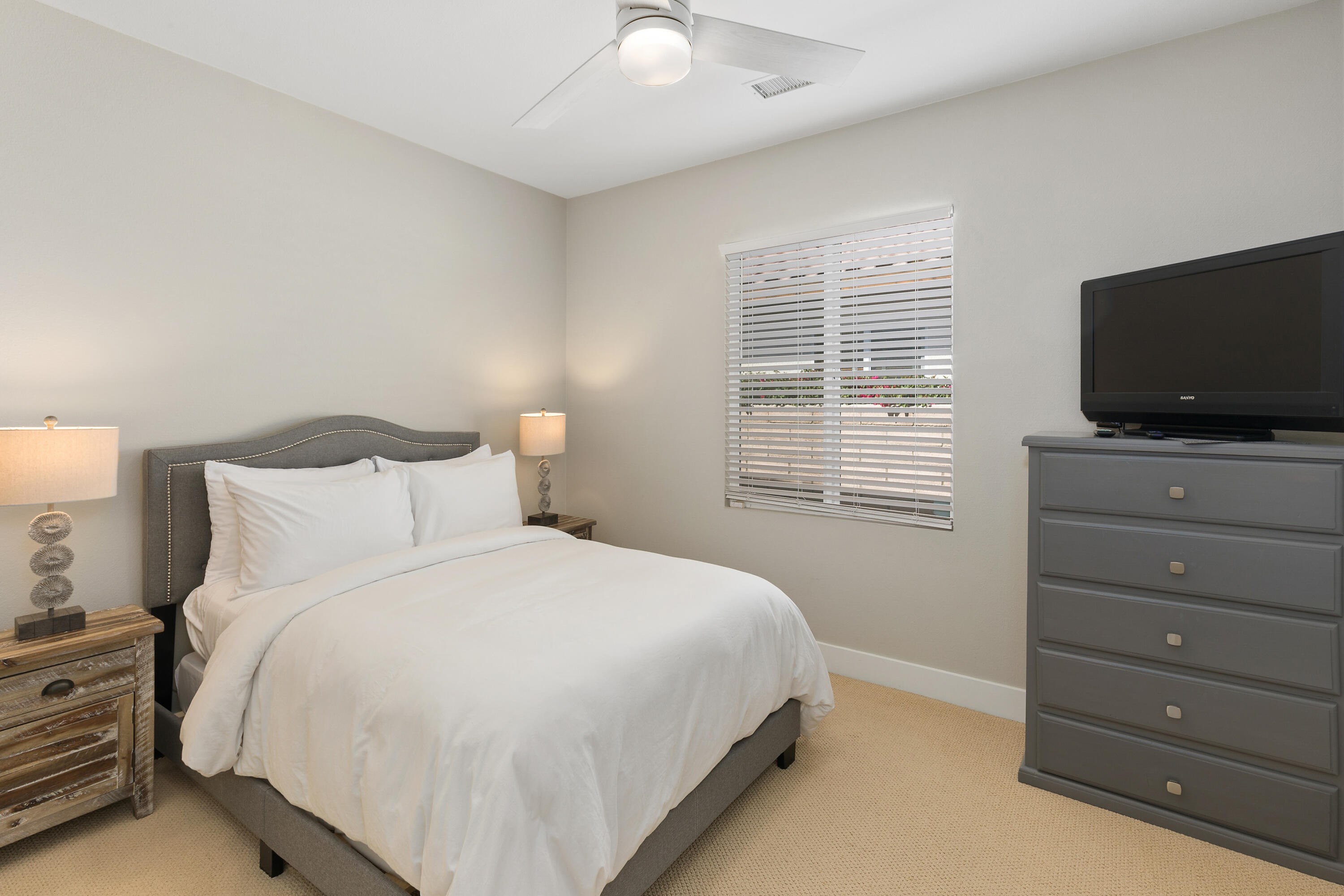 49377 Biery Street Indio, CA 92201 - Photo 15 of 32 a bedroom with a bed and a flat screen tv