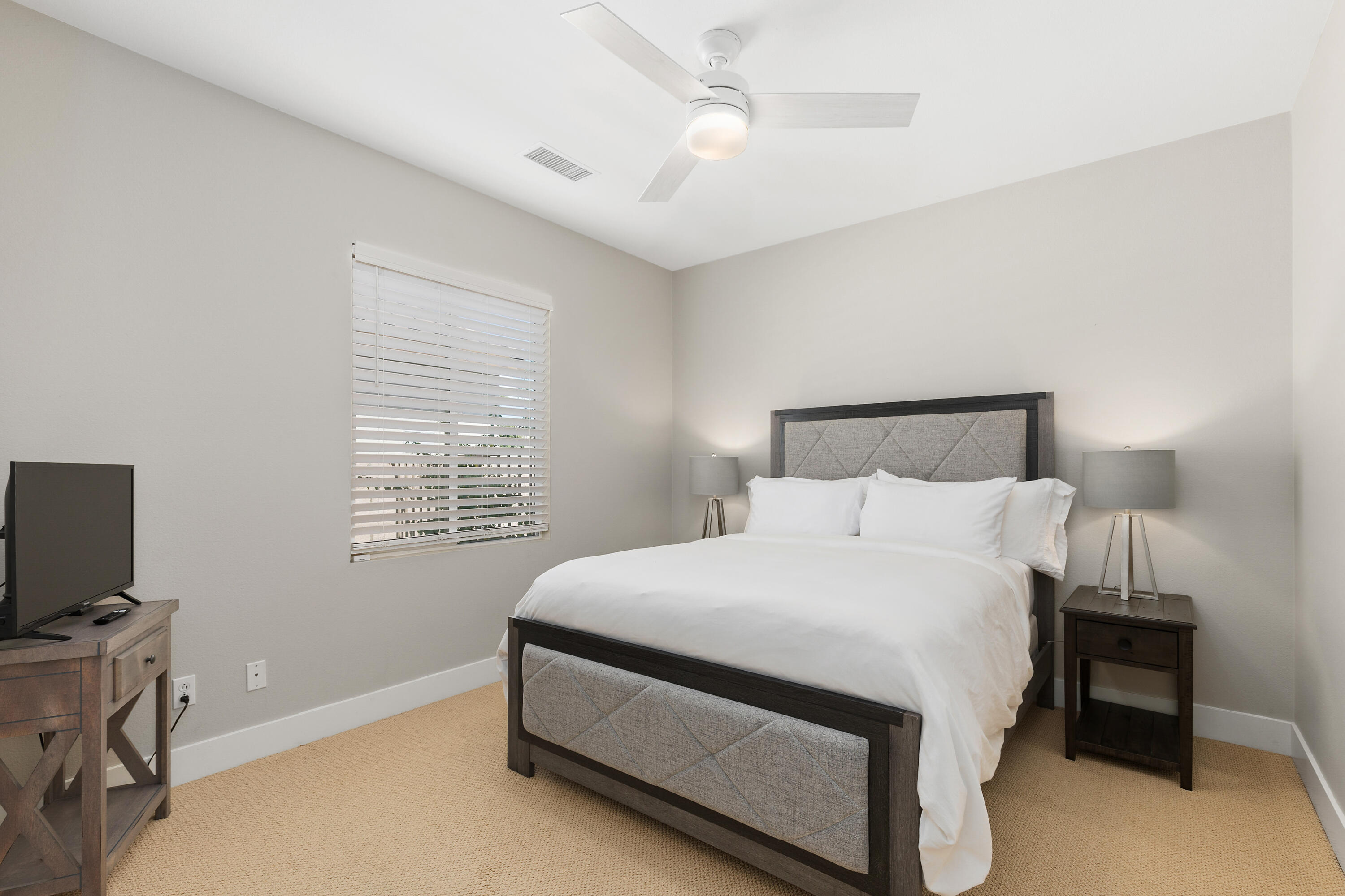 49377 Biery Street Indio, CA 92201 - Photo 16 of 32 a bed sitting in a bedroom next to a window