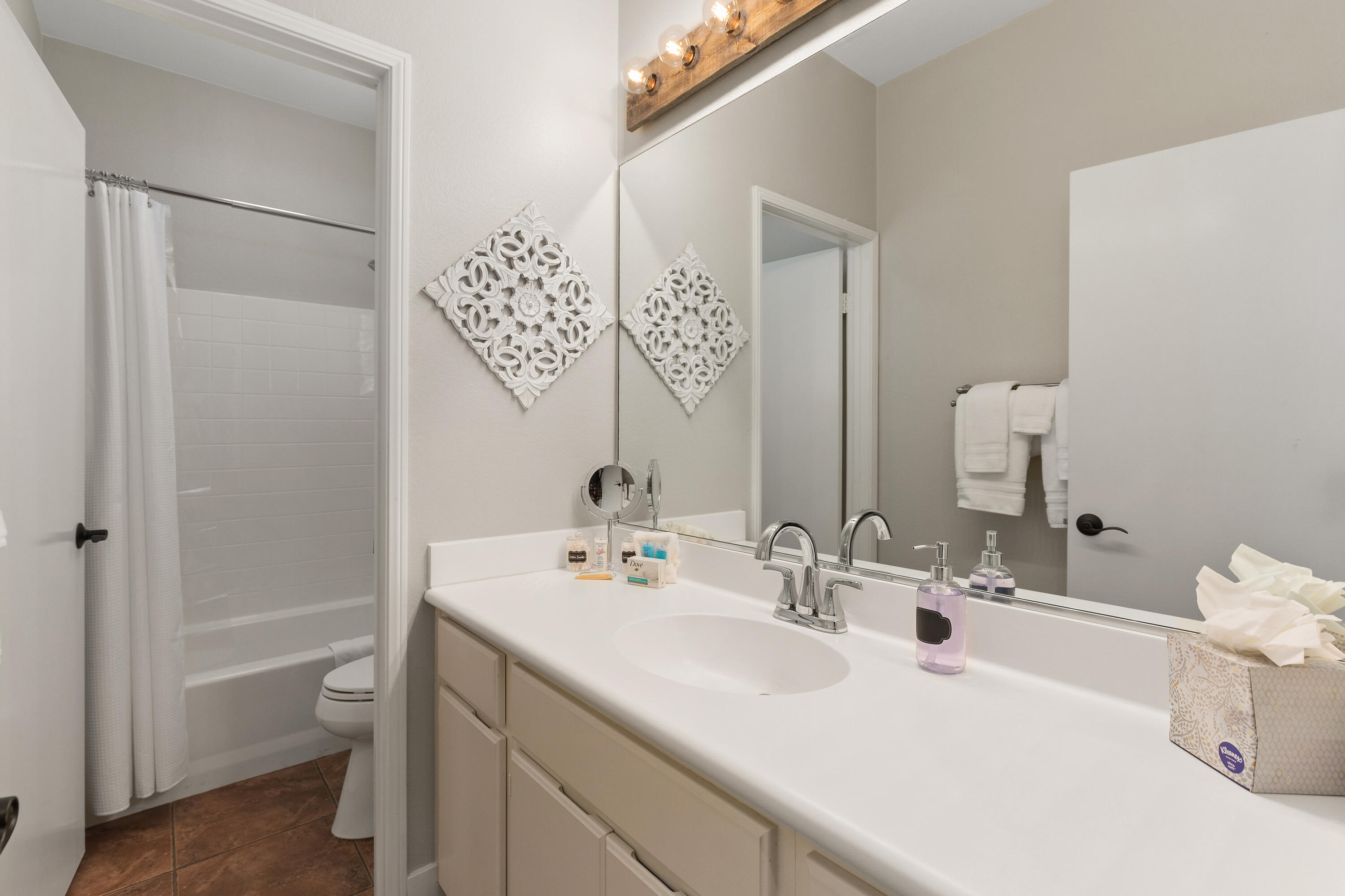 49377 Biery Street Indio, CA 92201 - Photo 17 of 32 a bathroom with a sink and a mirror