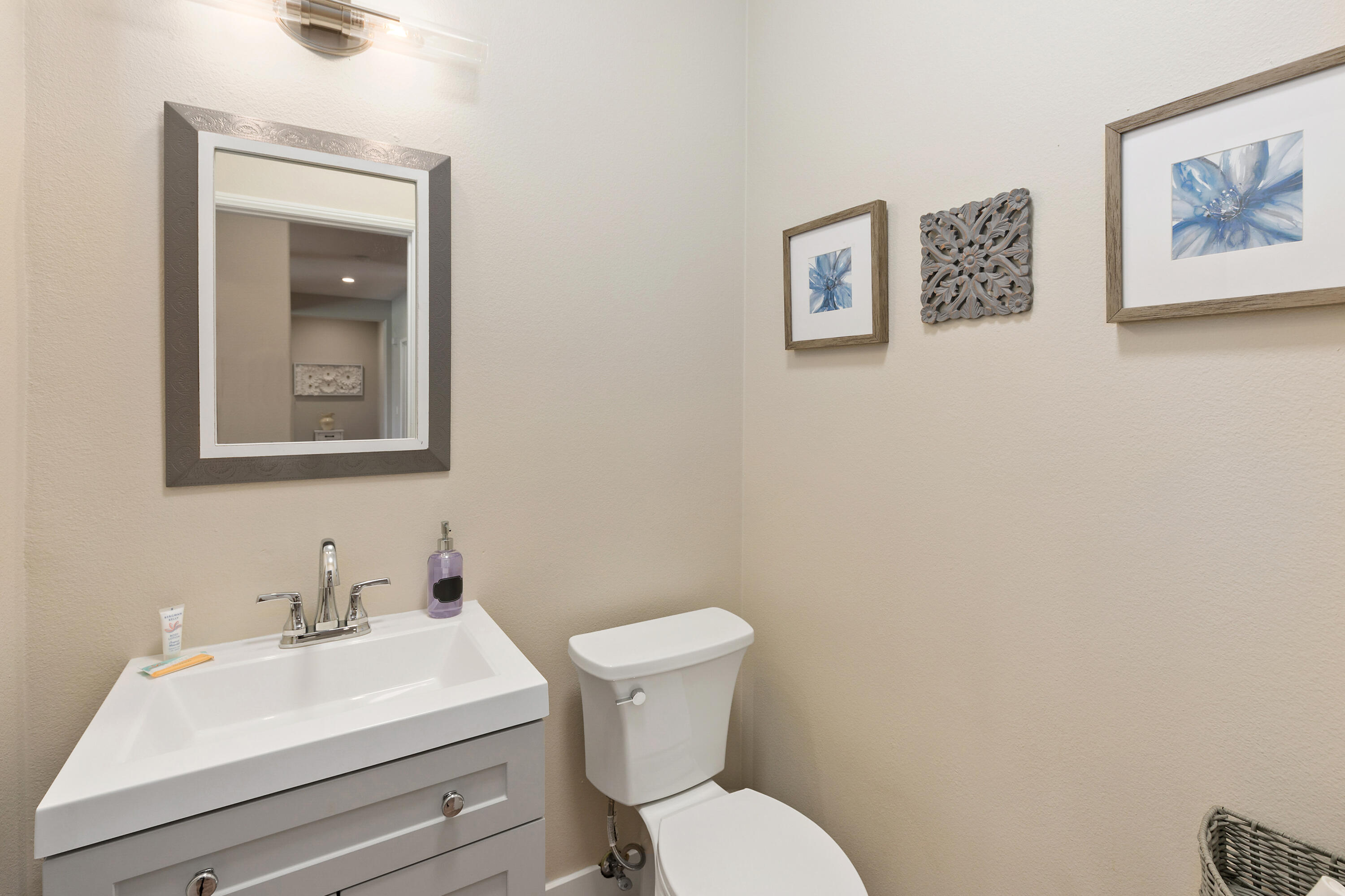 49377 Biery Street Indio, CA 92201 - Photo 18 of 32 a bathroom with a toilet a sink and mirror