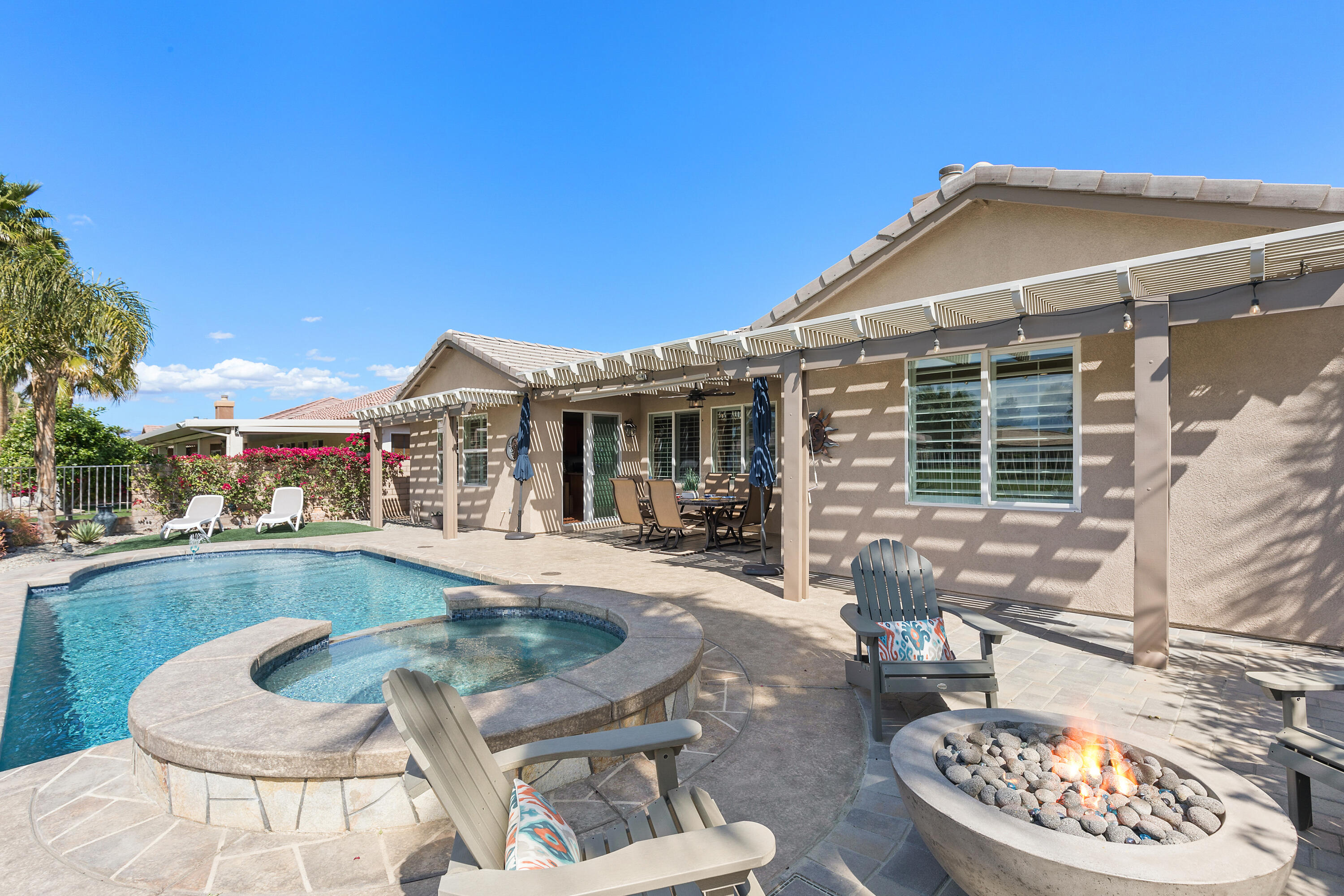 49377 Biery Street Indio, CA 92201 - Photo 22 of 32 a view of a house with swimming pool and sitting area