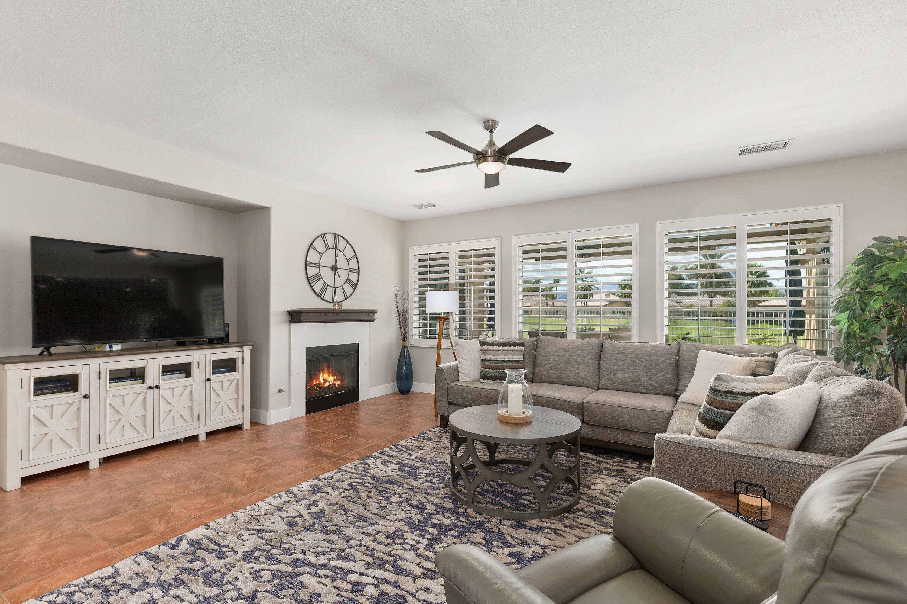 49377 Biery Street Indio, CA 92201 - Photo 4 of 32 a living room with furniture fireplace and flat screen tv