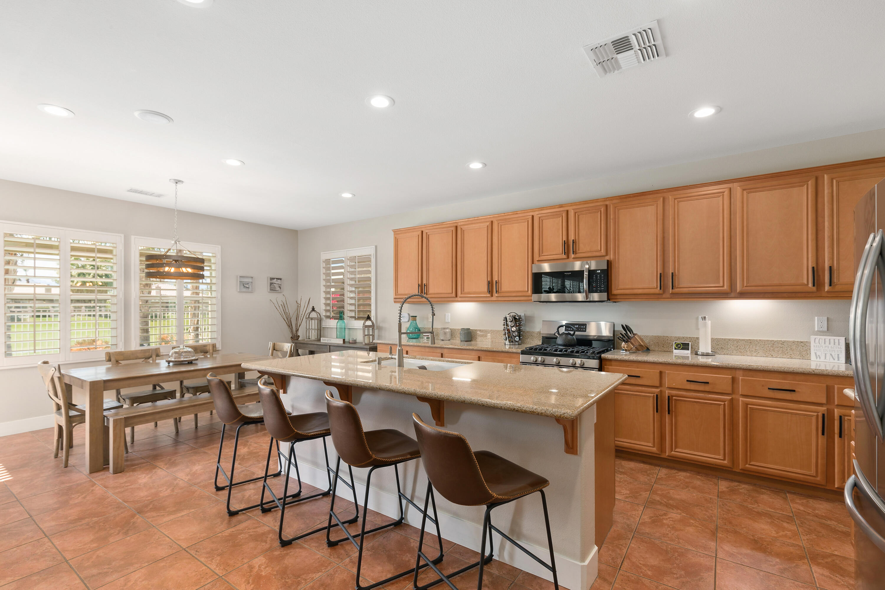 49377 Biery Street Indio, CA 92201 - Photo 8 of 32 a kitchen with lots of counter top space and appliances