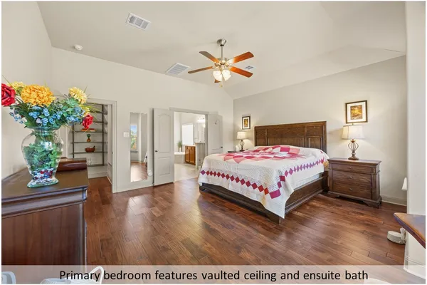 a bedroom with a bed table and a couch