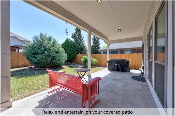 a view of a backyard with sitting area