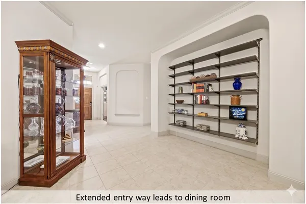 a view of an empty room with shelves